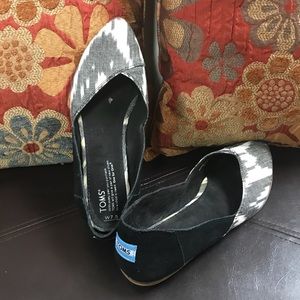 Black and white hard bottom Toms.